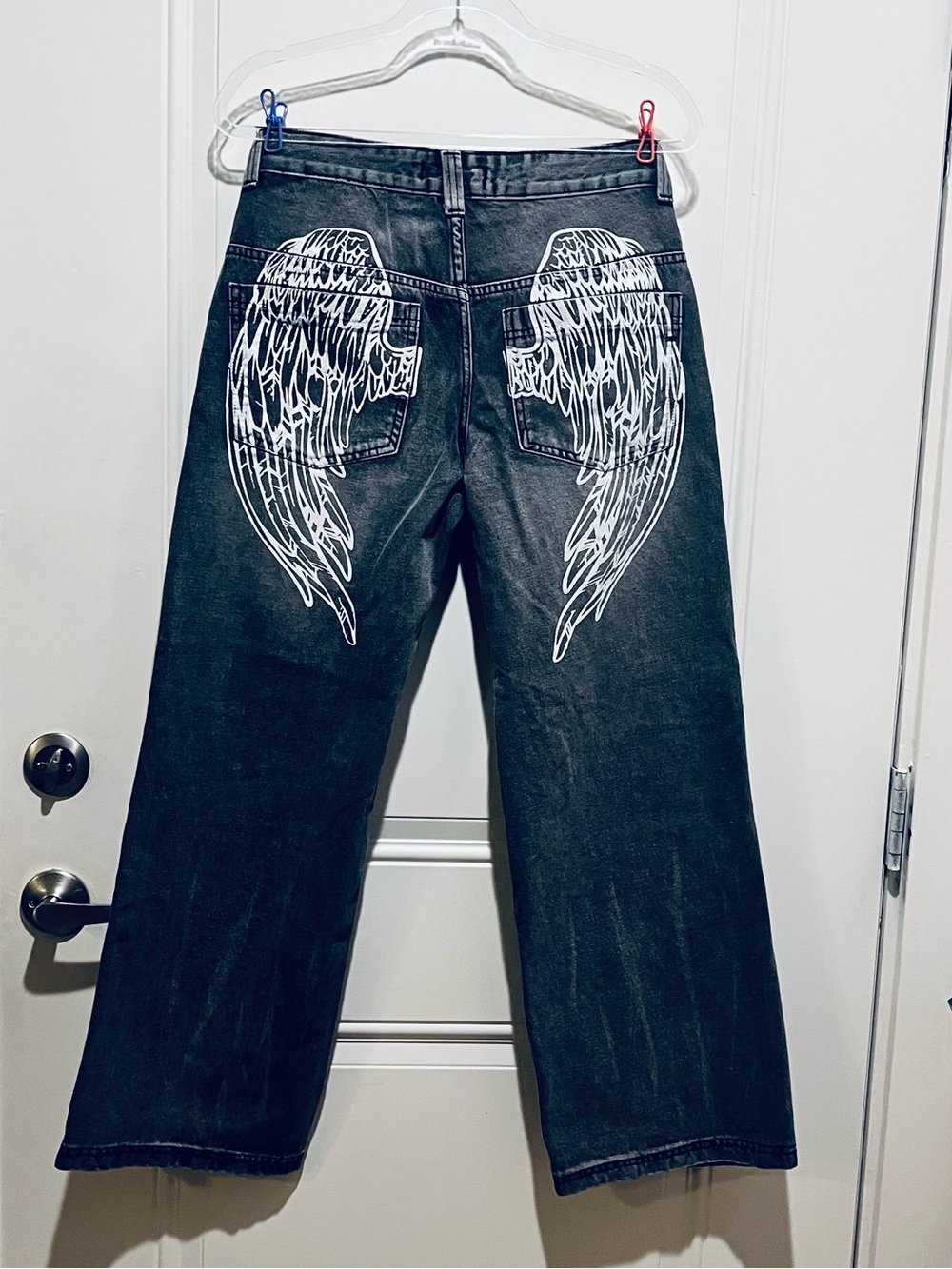 Women's Black Wide-Leg Jeans with White Wing Pocket Design